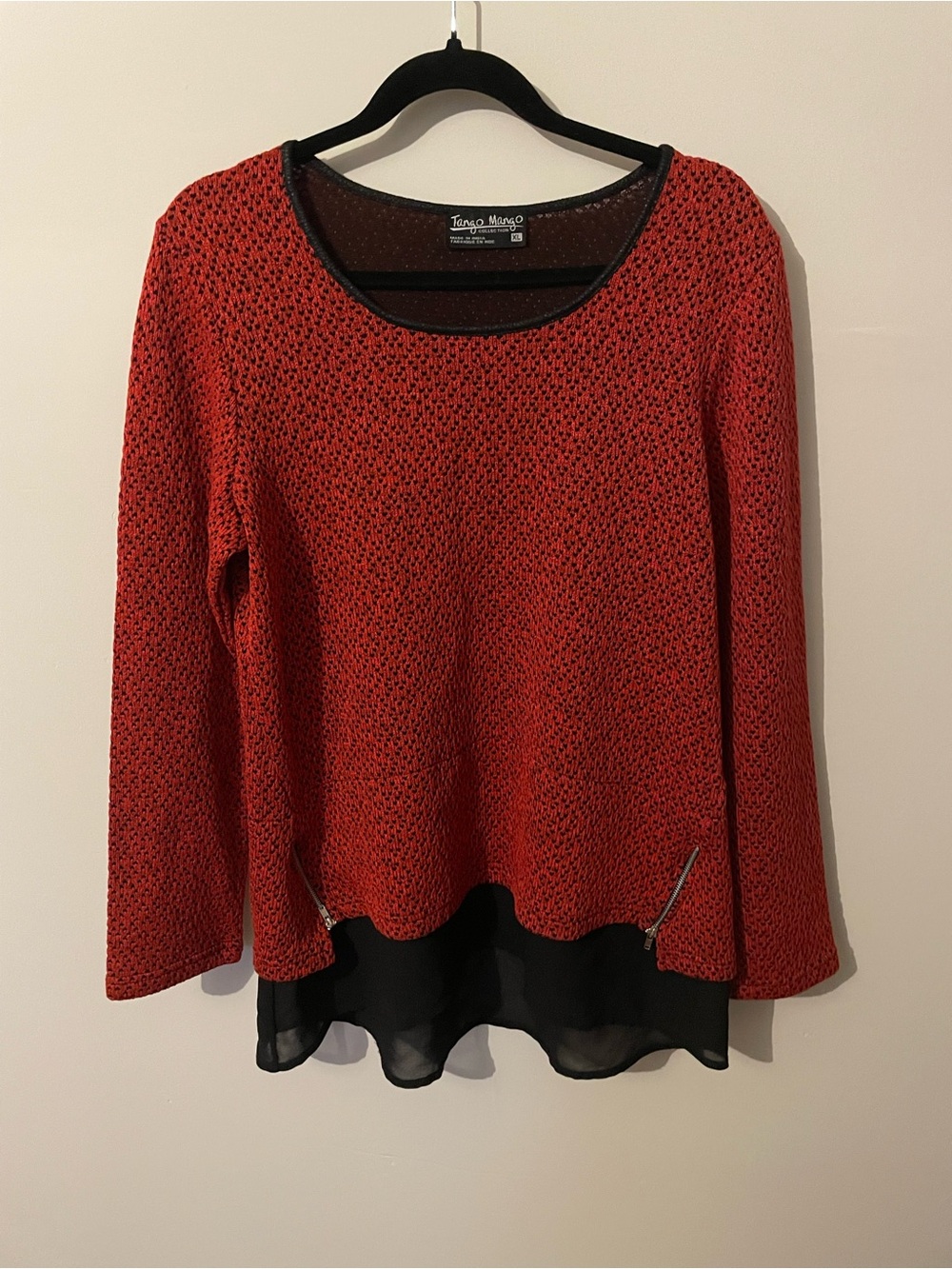 Red-orange and black top with heart details